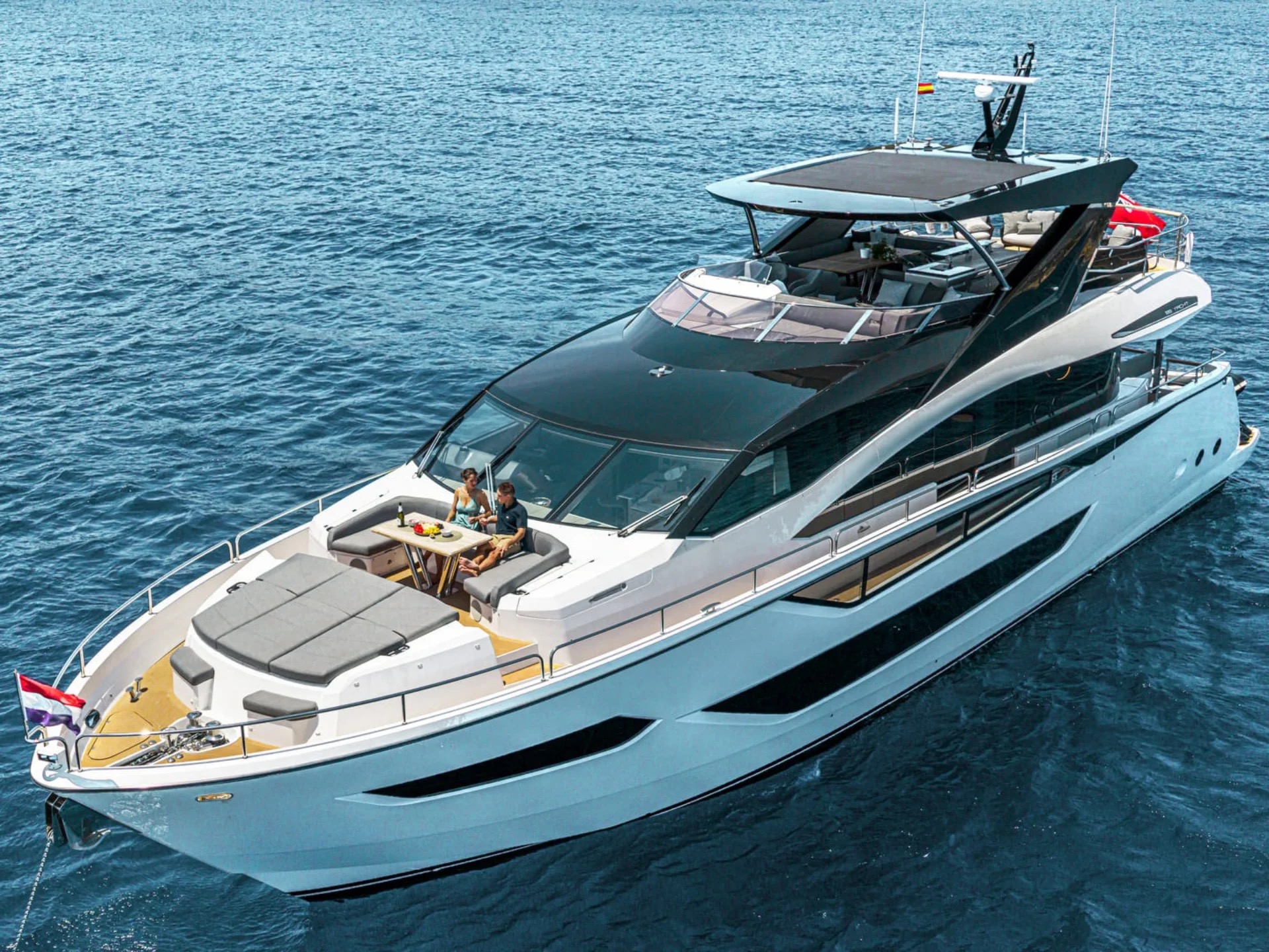 Aerial view of guests dining on foredeck of M/Y Junior Sunseeker 88 — charter Mallorca