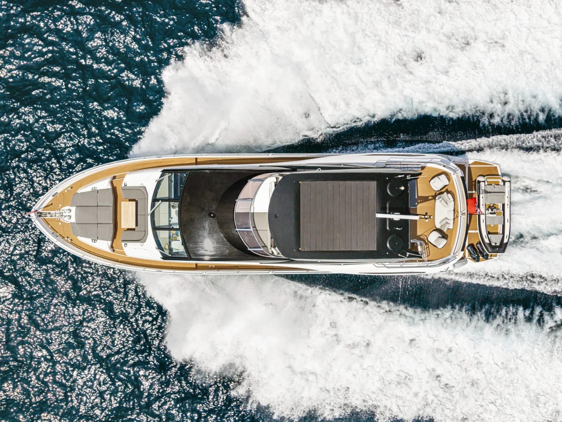 Aerial top-down view of M/Y Junior Sunseeker 88 underway — charter yacht Mediterranean