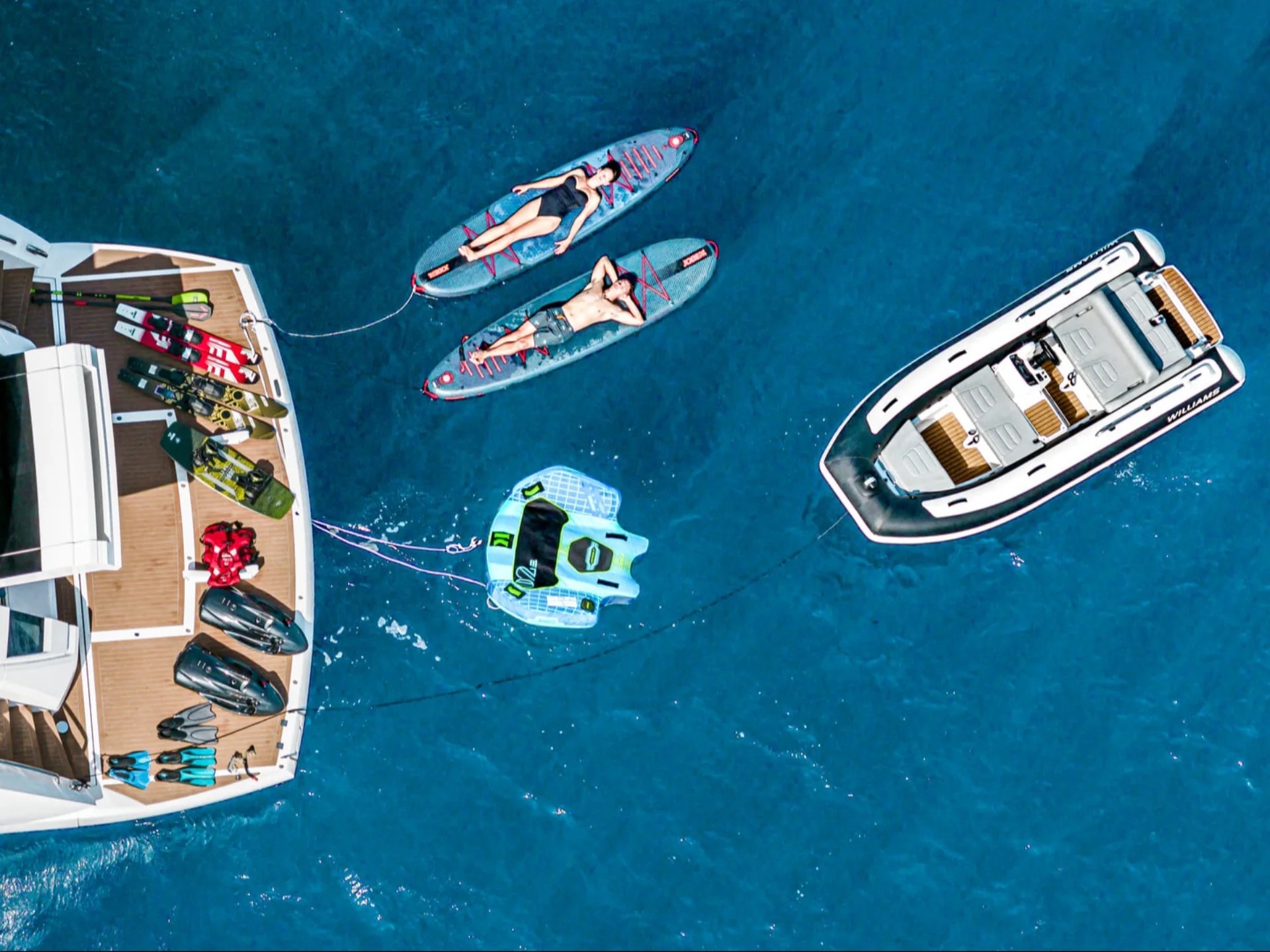 Aerial view of M/Y Junior Sunseeker 88 with water toys deployed — yacht charter Balearic Islands