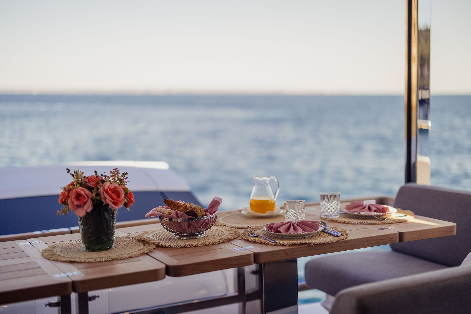 Breakfast table setting at sea aboard M/Y Junior Sunseeker 88 — luxury charter dining