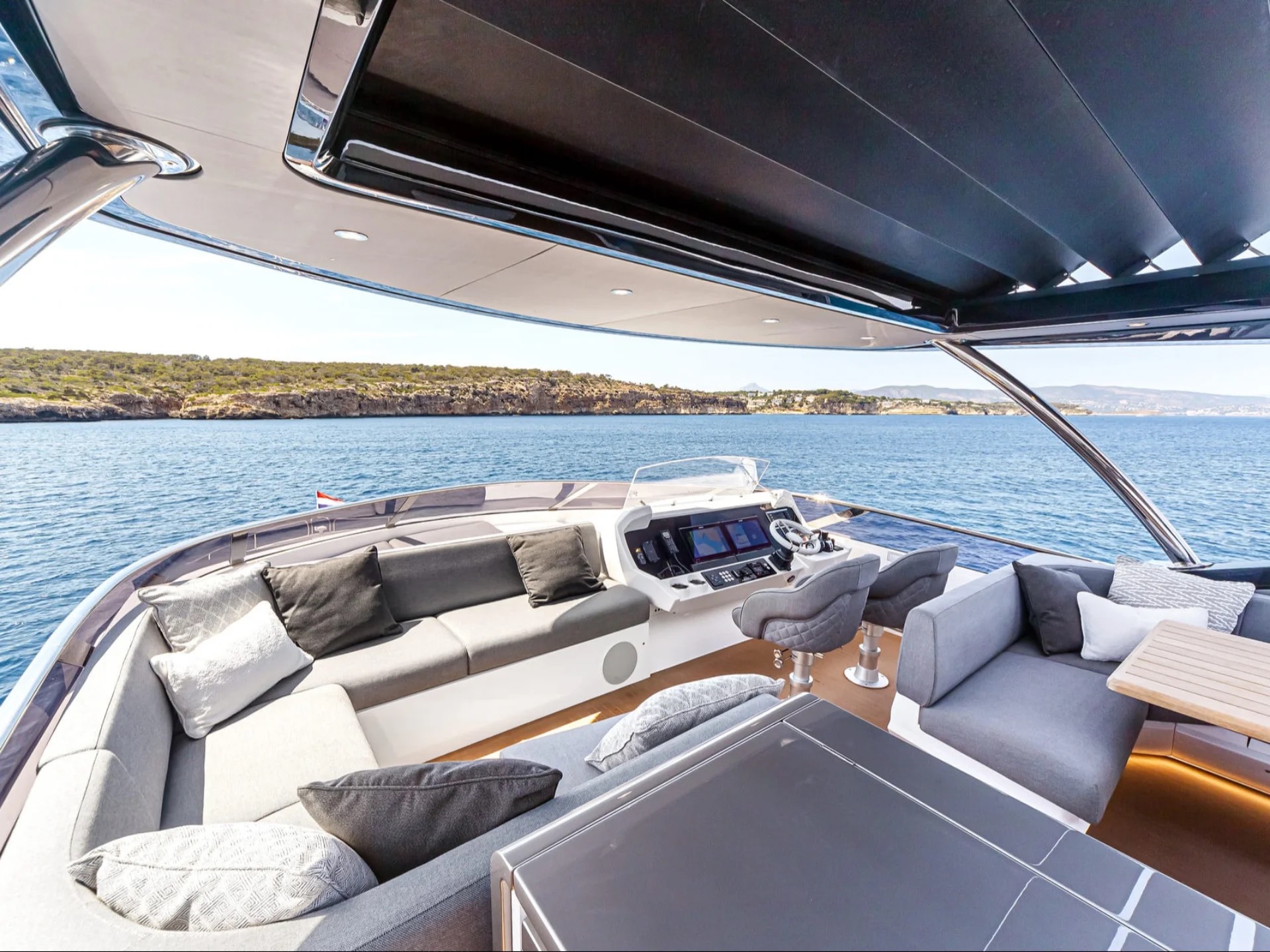 M/Y Junior Sunseeker 88 flybridge helm station — luxury yacht charter