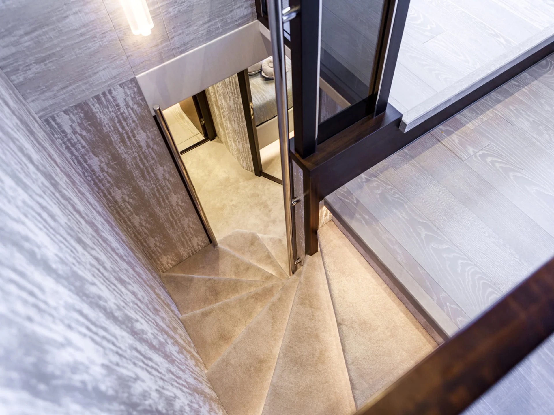 M/Y Junior Sunseeker 88 interior staircase to salon — luxury yacht charter