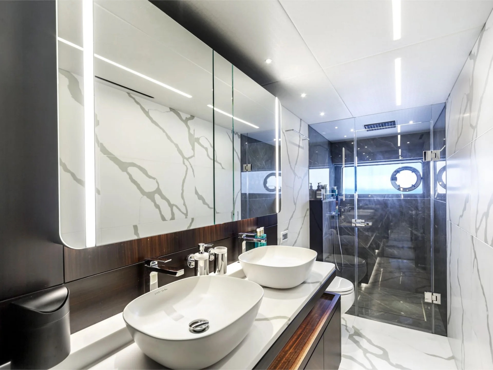 M/Y Junior Sunseeker 88 master en-suite bathroom with marble finishes — luxury yacht charter
