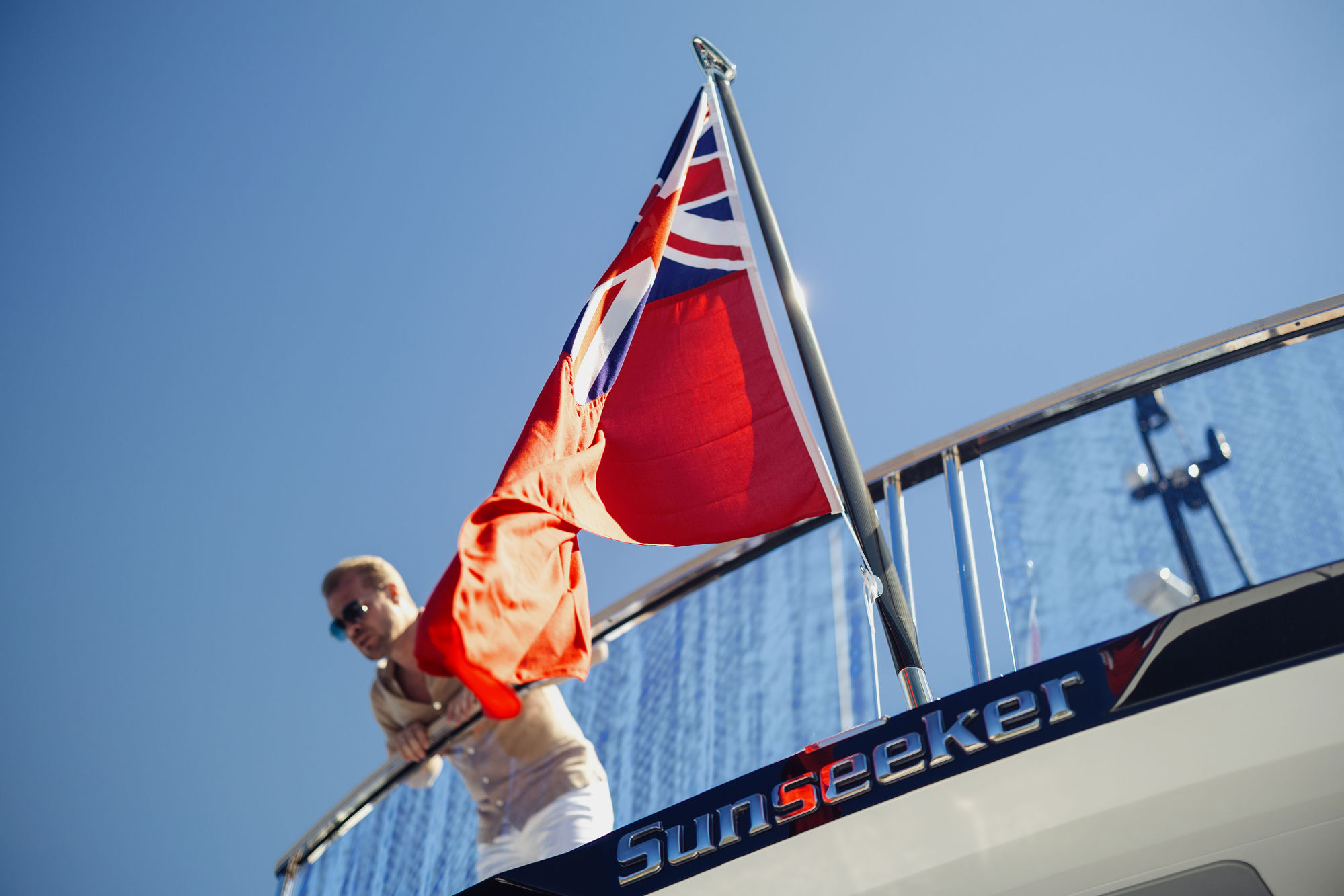 M/Y Junior Sunseeker 88 flag and Red Ensign — luxury yacht charter heritage
