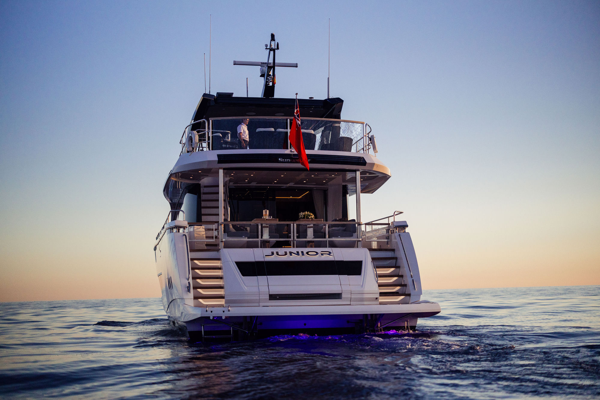 M/Y Junior Sunseeker 88 stern at twilight — luxury charter yacht Mallorca
