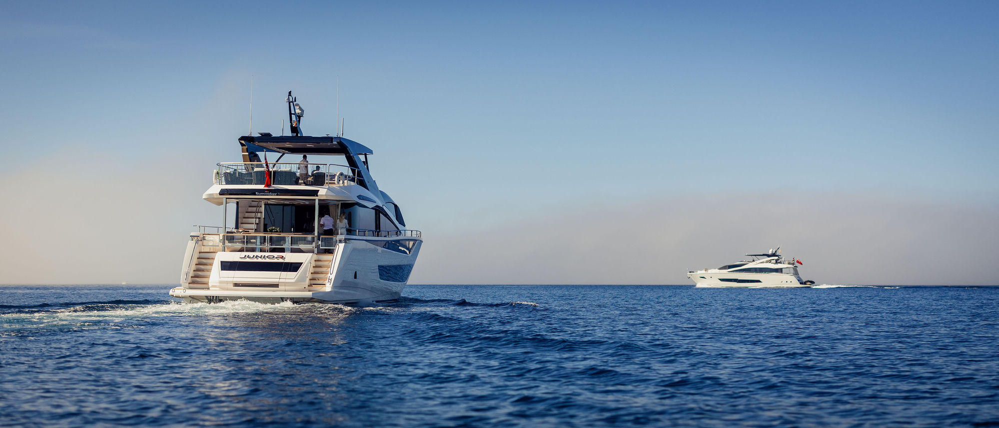 M/Y Junior Sunseeker 88 with companion yacht at sea — luxury charter Mallorca